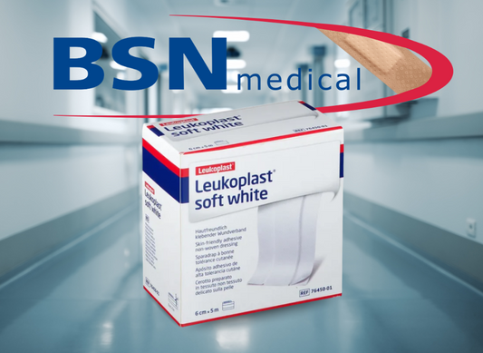The soft white plaster from Leukoplast in front of a clinical background